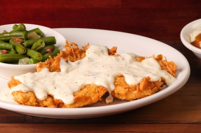 Country Fried Chicken topped with cream gravy at Texas Roadhouse