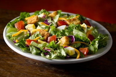 House Salad with lettuce, tomatoes, cheese, eggs, and croutons at Texas Roadhouse